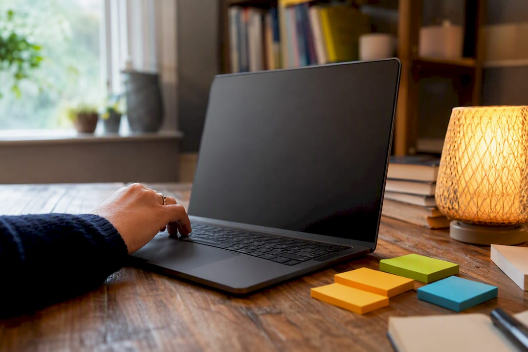 Laptop and headset on educator desk